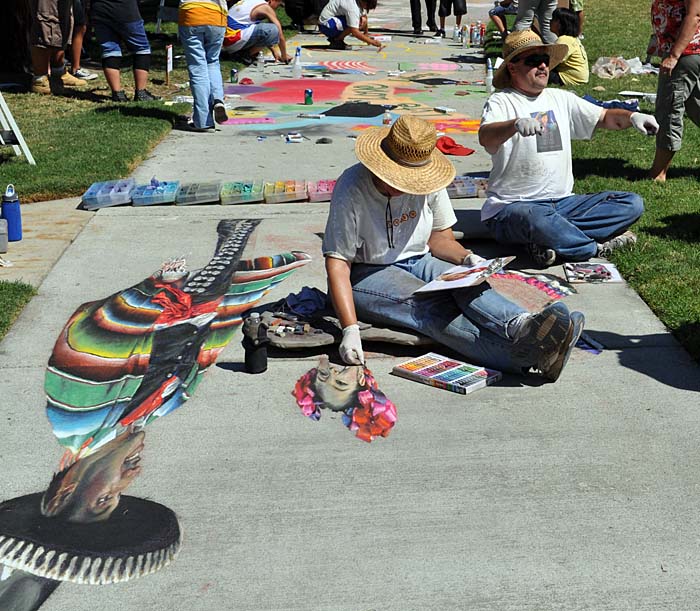 Cheryl and Wayne at work on the painting