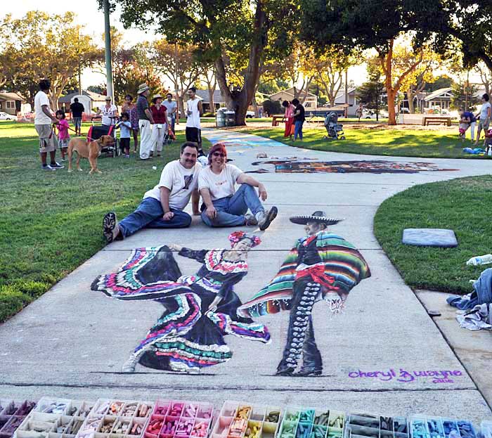 Wayne and Cheryl pose with the finished painting