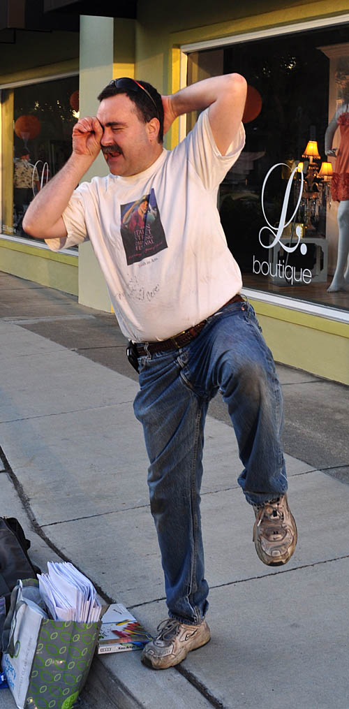 Wayne demonstrates the best way to view the painting