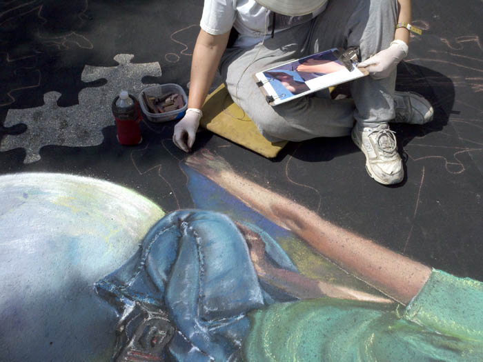 Cheryl paints Catie's hand