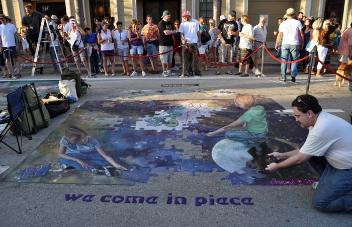 Wayne poses with the painting