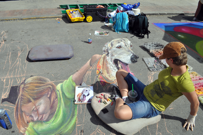 Alex leans back and looks at Buzby