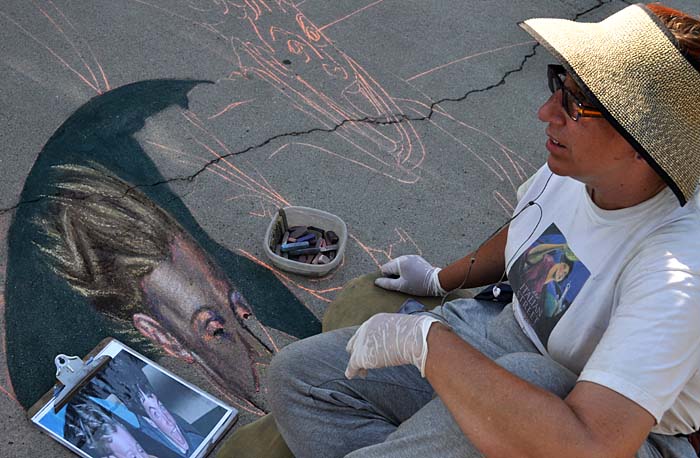 Cheryl paints Nolan's face