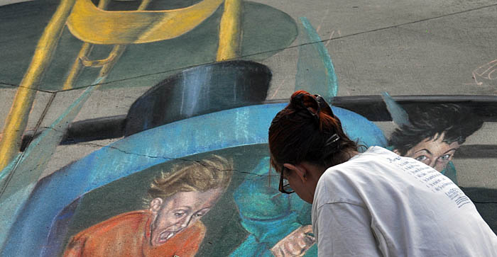 Nolan and Kyle peek over Cheryl's shoulder