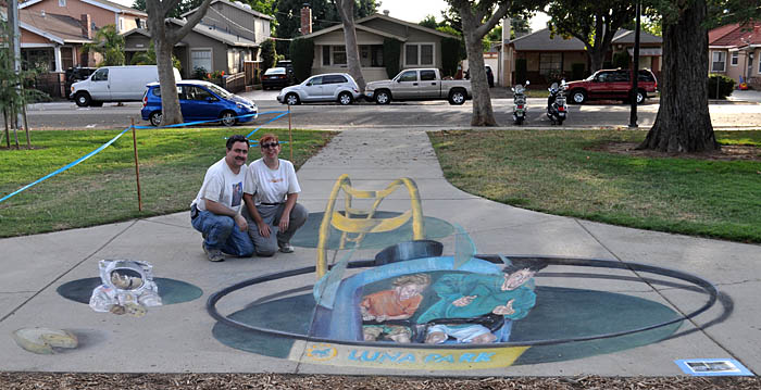 Wayne and Cheryl pose with the painting