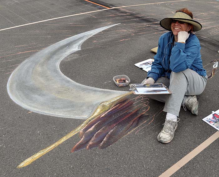 Cheryl paints the big fist holding the big sword