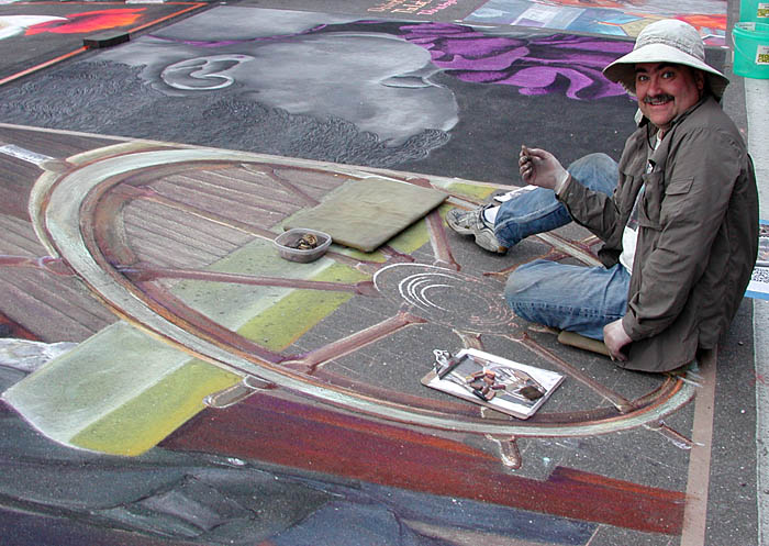 Wayne paints the ship's wheel